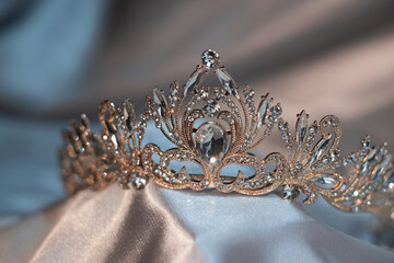 Vintage golden crown with qrystals and gemstones. Diadem for queen and princess