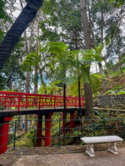 A marble bench offering a pocket of privacy in a botanical garden