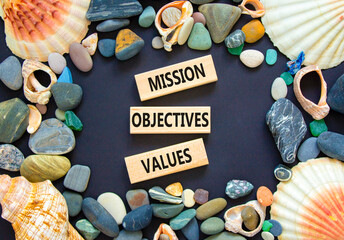 Mission objectives values symbol. Concept words Mission Objectives Values on beautiful blocks....