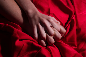 Tender couple in bed. Couple sensual touch. Hands of lovers. Woman pulling sheets. Hands of love....