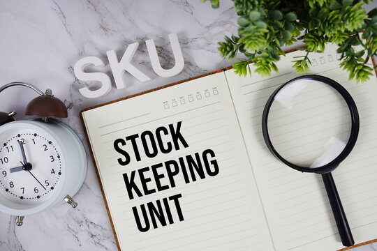 SKU - Stock Keeping Unit acronym on notepad, Business concept background