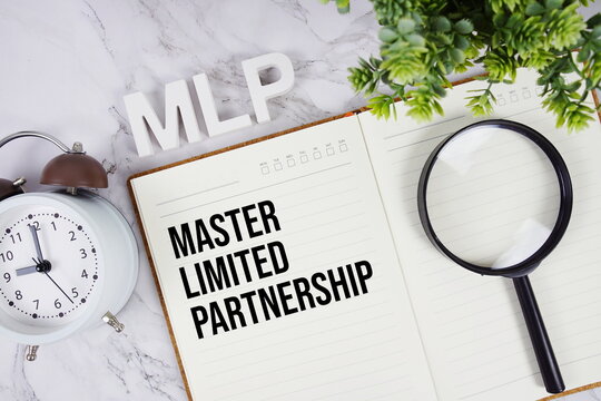 MLP - Master Limited Partnership acronym on notepad, Business concept background