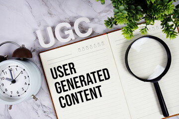 UGC - User Generated Content acronym on notepad, Marketing concept background