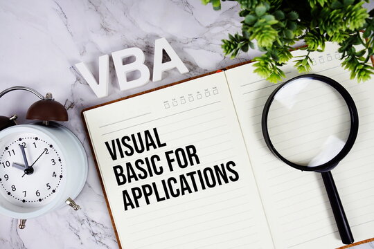VBA - Visual Basic for Applications acronym on notepad, Financial concept background
