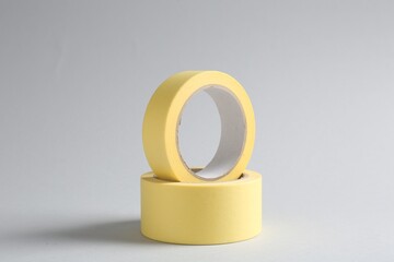 Two masking tapes on grey background, closeup
