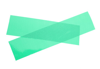 Cross made with green adhesive tape isolated on white, top view