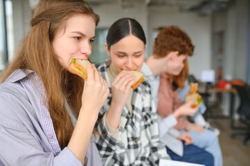 Pupils having lunch in classroom
