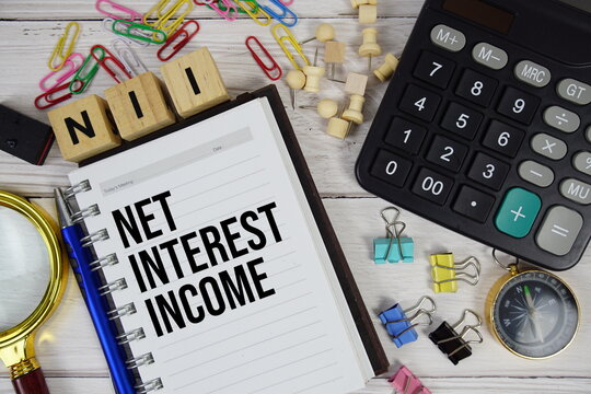 NII - Net Interest Income acronym on notepad, Business and Financial concept background