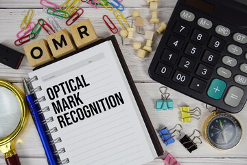 OMR - Optical Mark Recognition acronym on notepad, Business concept background
