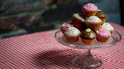 Cup of Tea and Cup Cakes on Gingham Table Cloth