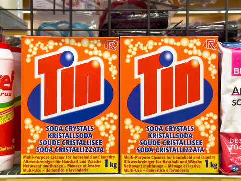 Tin soda crystals packaging on store shelf for household and laundry cleaning