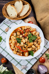 Lobio is a dish of Georgian, Azerbaijani and Armenian cuisines made from green bean pods. Traditional Georgian cuisine lobio. Lean dish. Lobio with pepper, onion. Top view. Flatlay