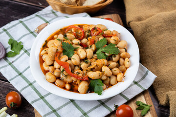 Lobio is a dish of Georgian, Azerbaijani and Armenian cuisines made from green bean pods. Traditional Georgian cuisine lobio. Lean dish. Lobio with pepper, onion. Side view.