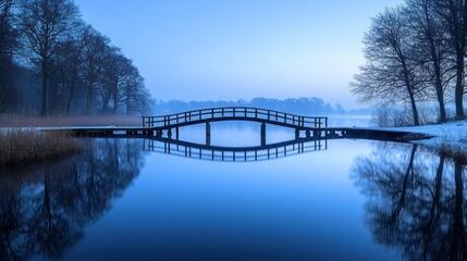 Obraz premium Peaceful winter landscape, serene wooden bridge over a still lake