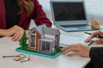 Businessmen and women representing home and real estate companies and providing real estate marketing advice.