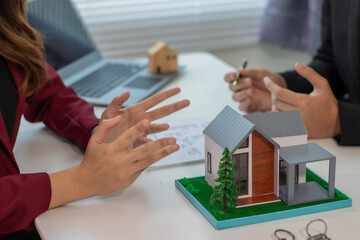 Businessmen and women representing home and real estate companies and providing real estate marketing advice.