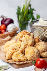 Cauliflower fries, lean dish, cauliflower in batter. Healthy fast food. Low-calorie food fries. Cabbage, tomatoes. Deep fryer. High quality photo.