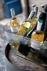 Tasting white wine on a wooden barrel