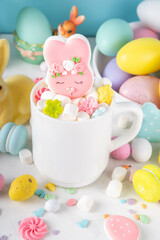Easter holiday  hot chocolate with funny bunny rabbits creative made with marshmallows, greeting card, child morning party invitation, Easter hot drinks menu background