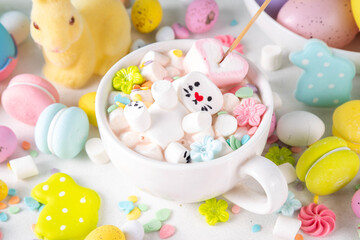 Easter holiday  hot chocolate with funny bunny rabbits creative made with marshmallows, greeting card, child morning party invitation, Easter hot drinks menu background