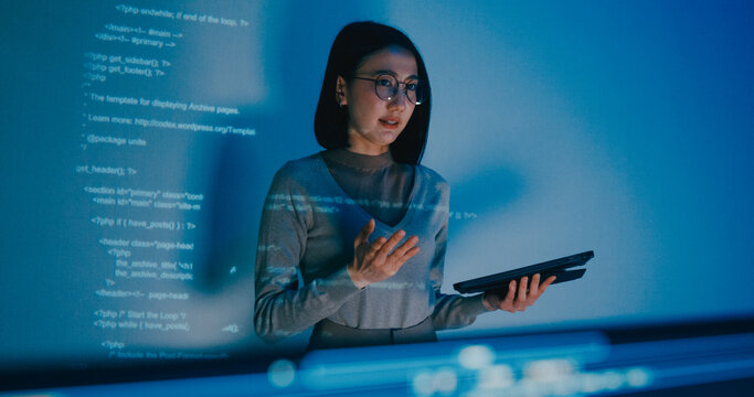 Group adult Asia female software developer mentor leader manager talk strategy plan to executive write prompt AI bot IT app program nomad, video game, designer, data center. Projecting slideshow code.