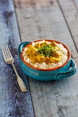 curried chicken served on a bed of rice