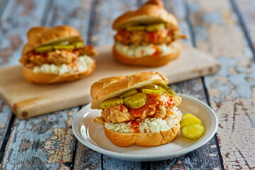 fried chicken sandwich with hot sauce