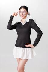 Fototapeta premium Confident Woman in Stylish Black and White Outfit Posing for Portrait advertisement Photography.