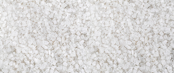 Coarse sea salt crystals forming a textured background