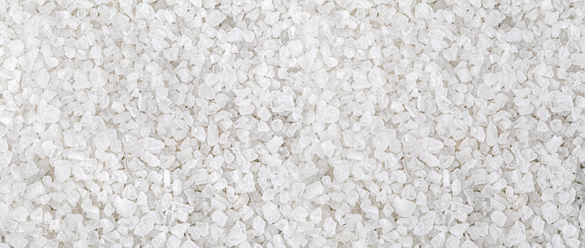Coarse sea salt crystals forming a textured background