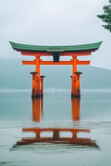 Red gate stands in water. Ocean landscape scene with bright painted gate and reflection. Tranquil travel location with peaceful mood. Calm water.