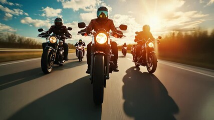 A group of motorcyclists traveling together. A group of bikers riding a high-speed motorcycle on an empty road against a beautiful cloudy sky