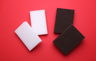 Kitchen sponges on a red background