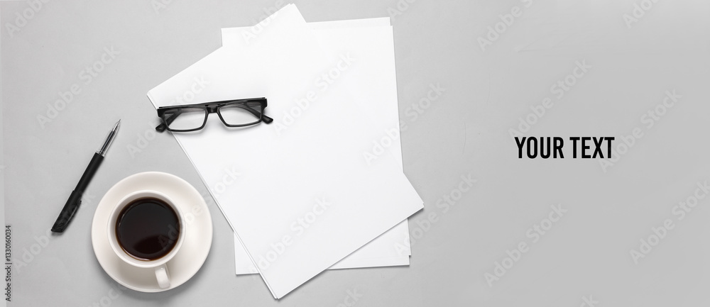 Poster white blank sheets of a4 paper size or documents mockup with pen, eyeglasses and coffee cup on a gra