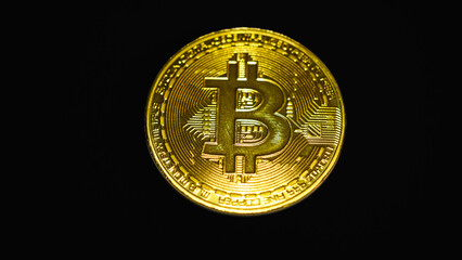 Bitcoin gold coin on dark background. Bitcoin & Cryptocurrency. Bitcoin. Crypto currency Gold Bitcoin, BTC, Bit Coin. Macro shot of Bitcoin coins isolated on black background.