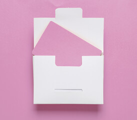 White packing box with pink bank card on pink background. Template for design