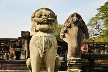 Seven heads Naga and Leo or Lion sand stone carving statue of Prasat Hin Phimai in Phimai...