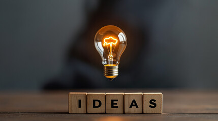  Glowing Light Bulb with "IDEAS" Text on Dark Background – Banner with Copy Space