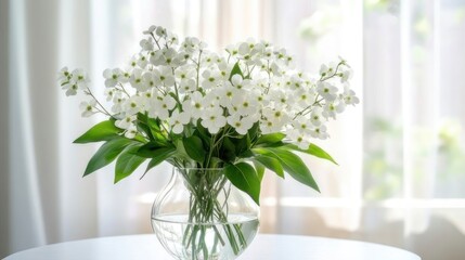 Beautiful bouquet of white flowers in a clear vase