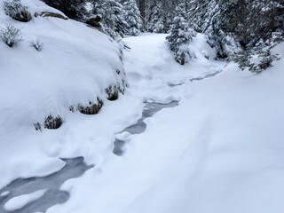 abstract winter background with frozen lake. snow and ice texture. frozen surface. minimalistic natural pattern with white snowdrift and icy