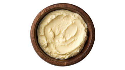Creamy mashed potatoes served in a brown wooden bowl on a white background ideal for hearty meals or holiday gatherings