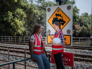 A team of accomplished rail transport professionals or railway engineers are conducting structural...