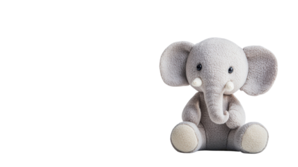 Soft gray elephant plush toy sitting on a white background evokes comfort and nostalgia for children and collectors alike