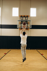 The athlete moves around the court, making a series of shots from different points, practicing the...