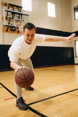 A young athlete performs ball dribbling exercises, practicing control and coordination of movements...