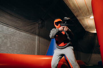 The player takes a steady stance, raising the gun and taking aim. He knows exactly when to make the...