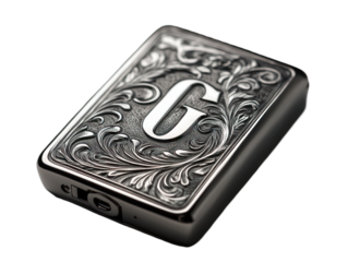 This image displays a metallic, rectangular device with an ornate, engraved design and a prominent letter "G".
