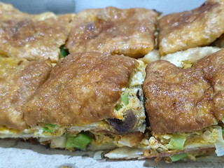 Martabak, Egg Martabak or Egg Martabak. Savory fried pastries filled with eggs, meat and spices. Martabak Telur is a typical Indonesian street snack.
