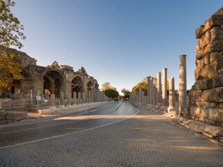 Obraz premium Ruins of the ancient city of Side. Stunned street of the amphitheatre. Morning light. Historical symbols of Antalya. 