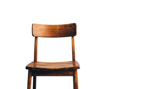 Wooden chair positioned against a blank wall in a well-lit indoor space